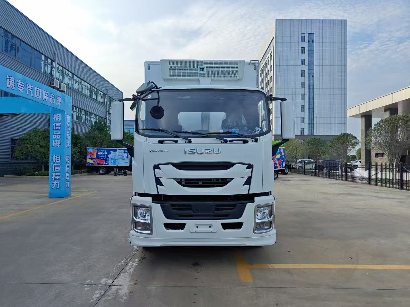 Front view of ISUZU GIGA 4x2 refrigerated truck for frozen food transport