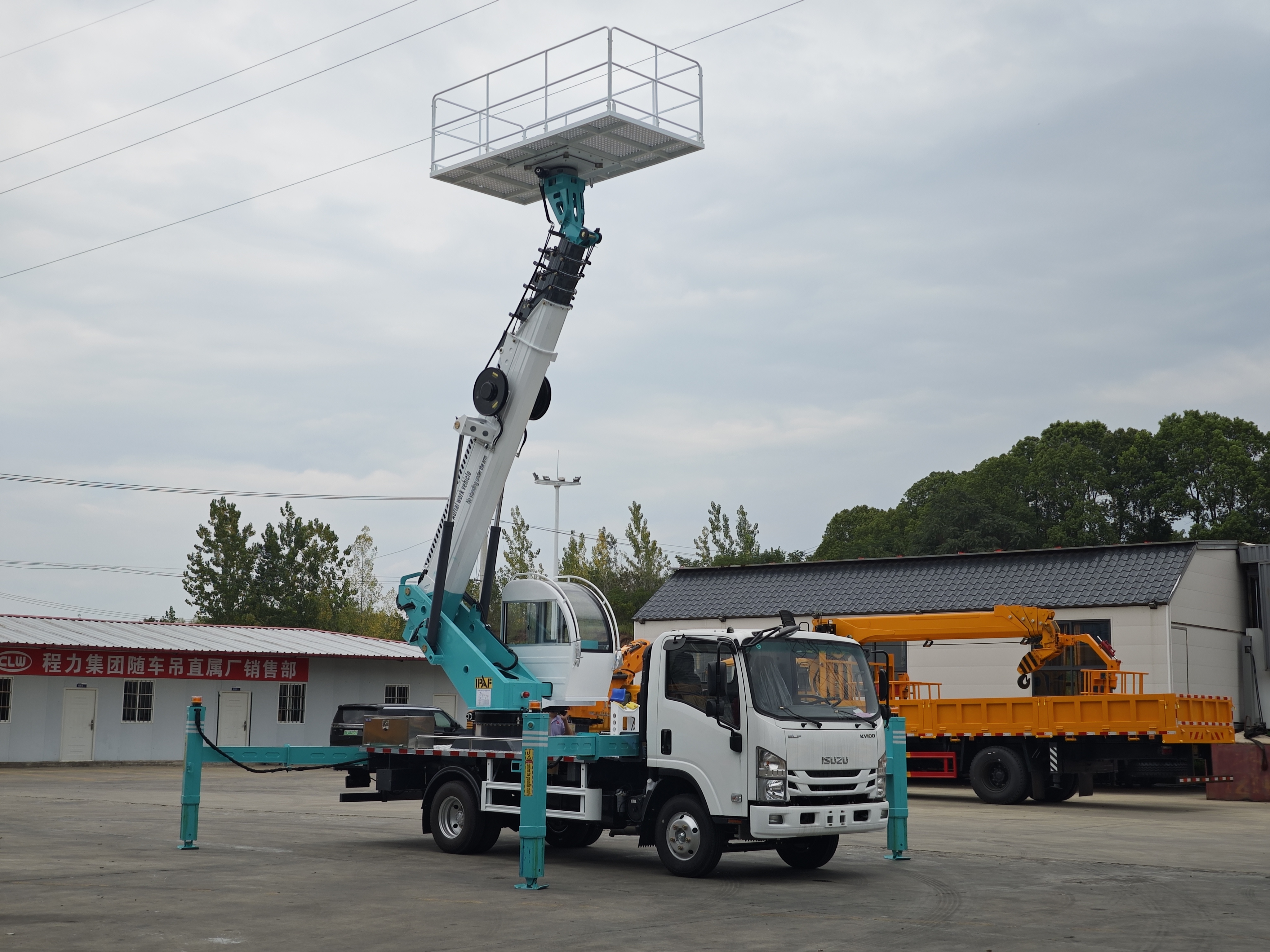 CLW ISUZU Giga 4x2 aerial work platform truck at urban site