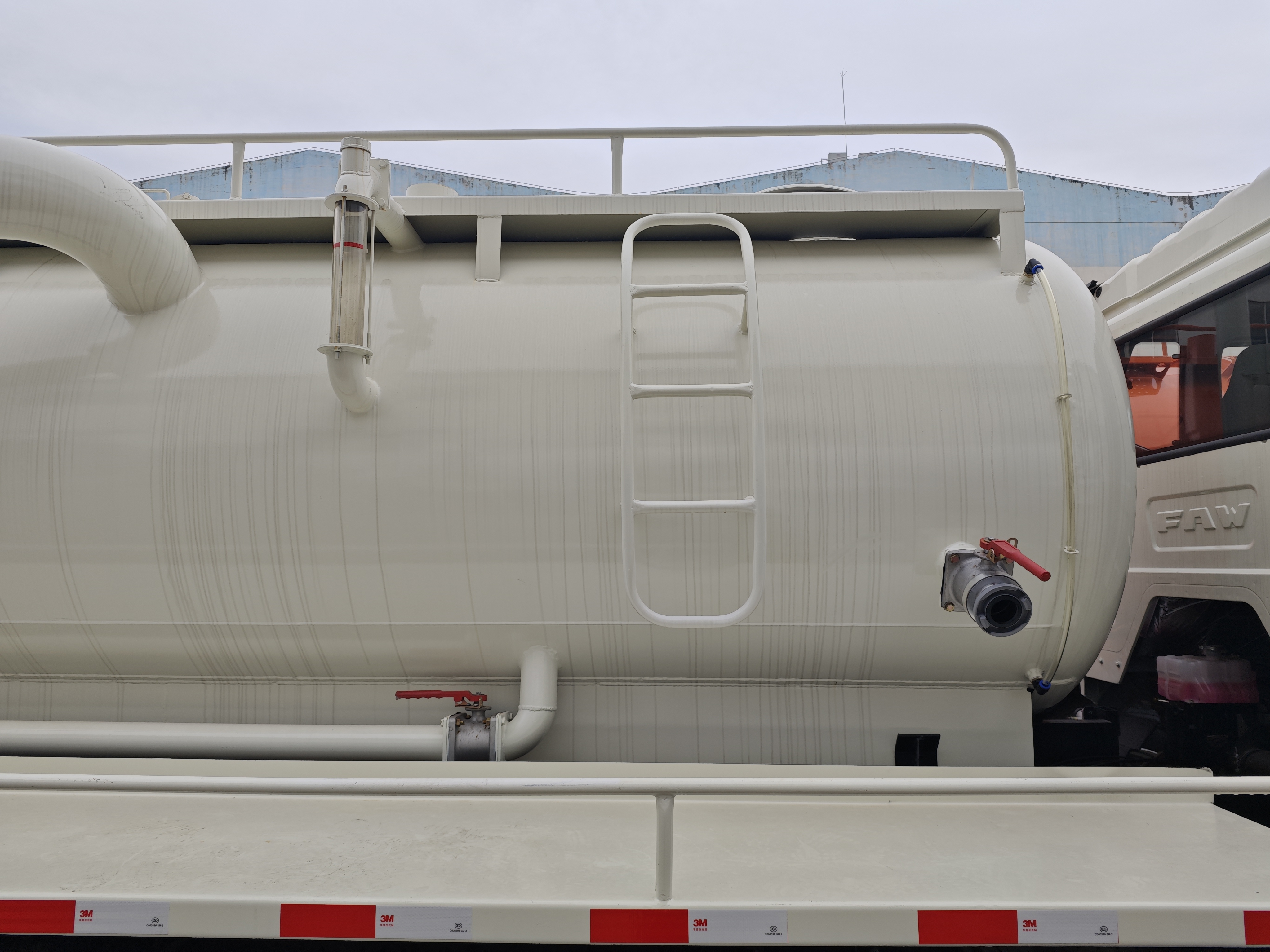 Heavy-duty FAW sewer vacuum truck at construction site