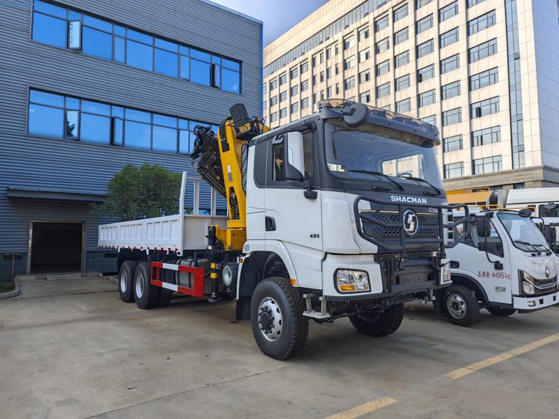 Front view of Shacman 6x6 truck showing WP12 engine power and 6x6 drivetrain