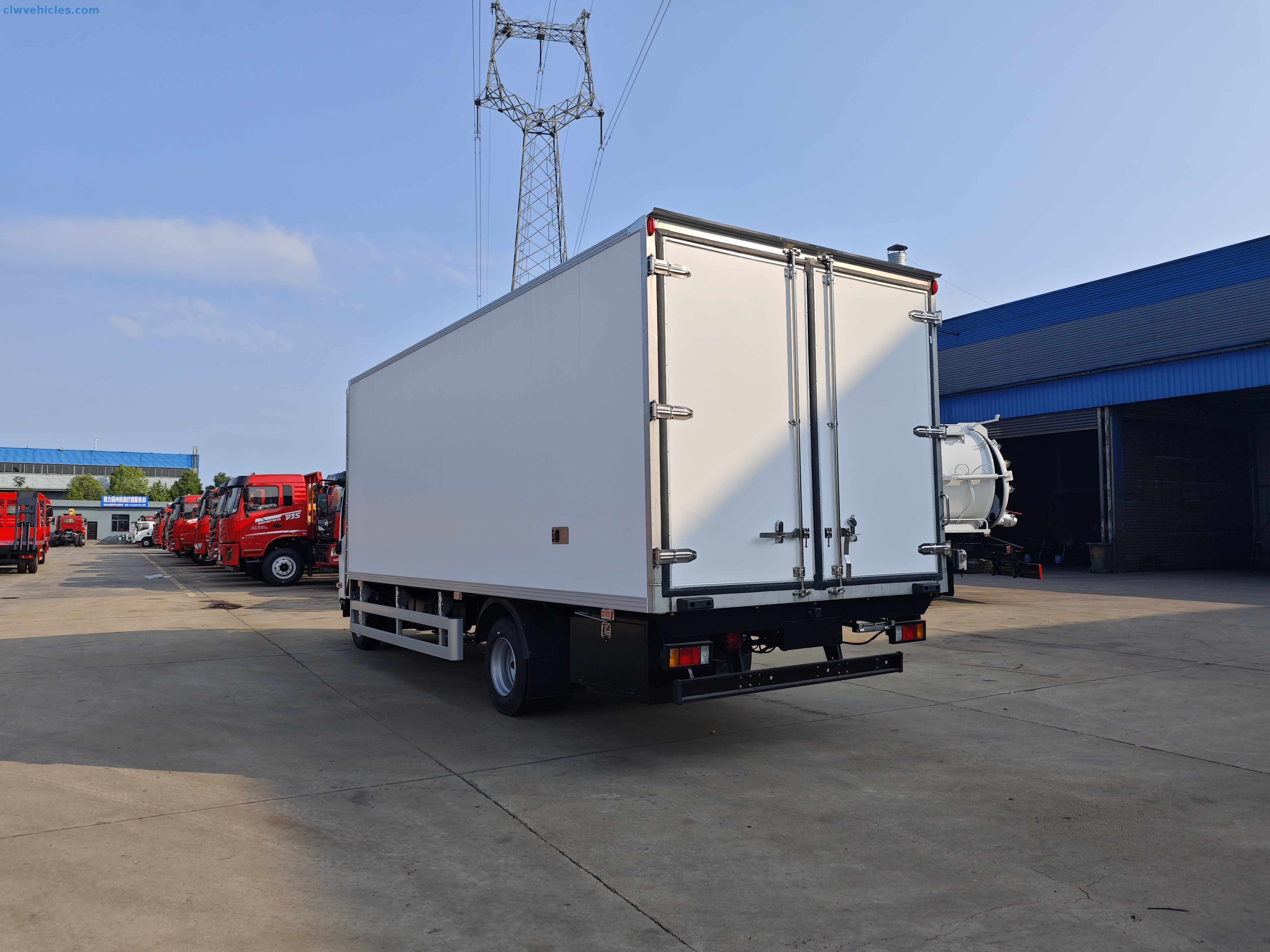 Rear cargo door of ISUZU refrigerated van open for loading
